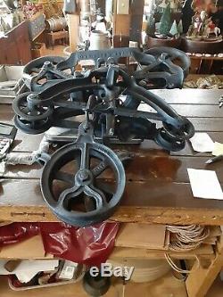 Antique CAST IRON HAY TROLLY WAS MADE IN HARVARD ILLINOIS. Large in size