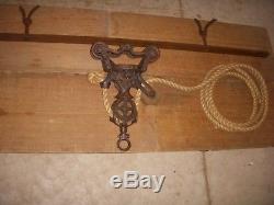 Antique barn hay trolley with rope