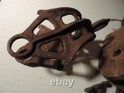 Antique barn pulleys, wood, cast iron and zinc large and small lot of 5