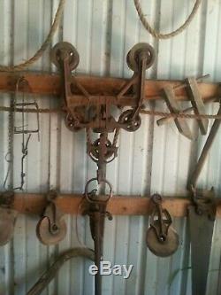 Antique barn trolley with one prong hay fork to move hay from wagon to haymile