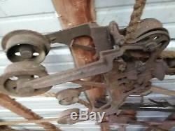 Antique barn trolley with one prong hay fork to move hay from wagon to haymile