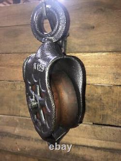 Antique vintage cast iron and wood barn pulley