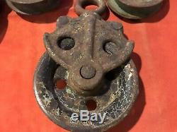 Four Antique Metal Pulleys