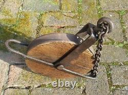 Huge antique pulley with iron chain from around 1880 from an old German mill