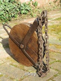 Huge antique pulley with iron chain from around 1880 from an old German mill