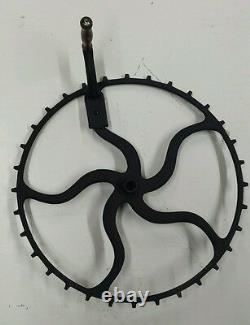 Large antique/primitive cast iron hand crank flywheel. (19 in diameter)