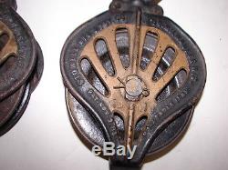 Pair antique Stowell Mfg Co 1885 cast iron hay trolley pulley steampunk
