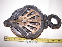 Pair antique Stowell Mfg Co 1885 cast iron hay trolley pulley steampunk