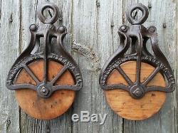 TWO J E PORTER Antique/VINTAGE CAST Iron AND WOOD PULLEYS ORNATE RUSTIC DECOR