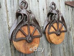 TWO J E PORTER Antique/VINTAGE CAST Iron AND WOOD PULLEYS ORNATE RUSTIC DECOR