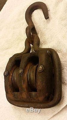 Unusual antique wood double block pulley framed in thick iron