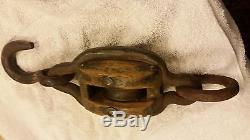 Unusual antique wood single block pulley framed in thick iron