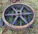 Vintage 4 foot industrial pulley with base very heavy steampunk! Iron